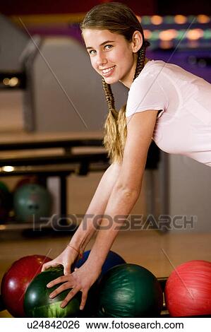 Teenage girl in a bowling alley View Large Photo Image Stock Photograph - Teenage girl in a bowling alley. Fotosearch