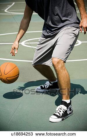 Man on an outdoor basketball court, close up View Large Photo Image Stock Image - Man on an outdoor basketball court, close up. Fotosearch