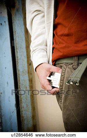 Portrait of a young man with cigarettes View Large Photo Image Stock Photograph - Portrait of a young man with cigarettes . Fotosearch