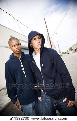 Stock Image - Portrait of two young street gang members. Fotosearch