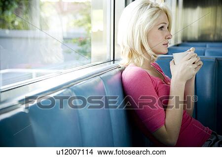 Picture - Portrait of a teenage girl hanging out at a diner. Fotosearch