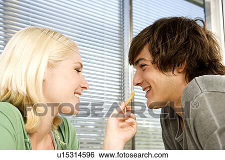 Stock Photograph - Teenage couple in a diner. Fotosearch