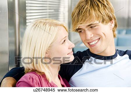 Stock Photography - Teenage couple sitting in a diner . Fotosearch