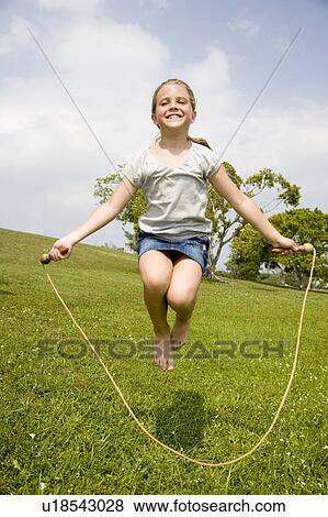 little girl skipping with skipping rope View Large Photo Image Stock Photo - little girl skipping with skipping rope. Fotosearch