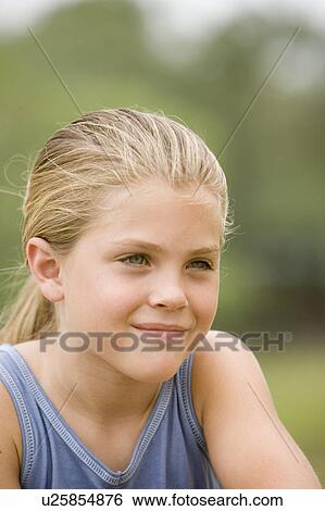 Stock Photograph - portrait blonde girl outdoor. Fotosearch