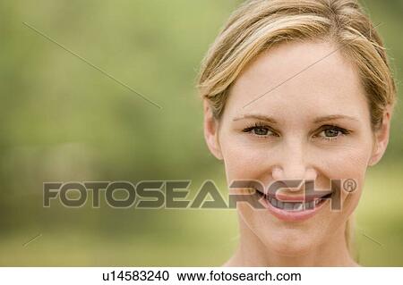 Stock Image - portrait blonde mid adult woman. Fotosearch