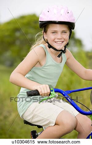 portrait girl on bicycle View Large Photo Image Stock Photography - portrait girl on bicycle. Fotosearch