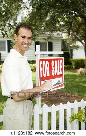 Estate agent outside property for sale View Large Photo Image Stock Image - Estate agent outside property for sale. Fotosearch