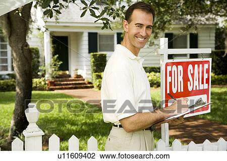 Estate agent outside property for sale View Large Photo Image Stock Image - Estate agent outside property for sale. Fotosearch