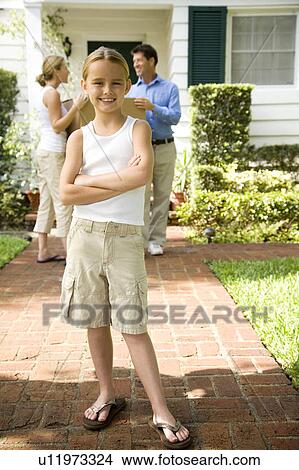 Family moving into their new home View Large Photo Image Picture - Family moving into their new home. Fotosearch