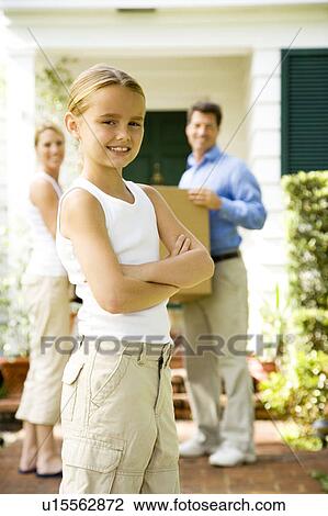 Family moving into their new home View Large Photo Image Stock Image - Family moving into their new home. Fotosearch