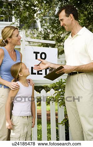 Mother and daughter consulting letting agent about property to let View Large Photo Image Stock Photo - Mother and daughter consulting letting agent about property to let. Fotosearch