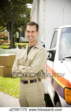 Removal man standing beside their van with packing boxes View Large Photo Image Stock Image - Removal man standing beside their van with packing boxes. Fotosearch