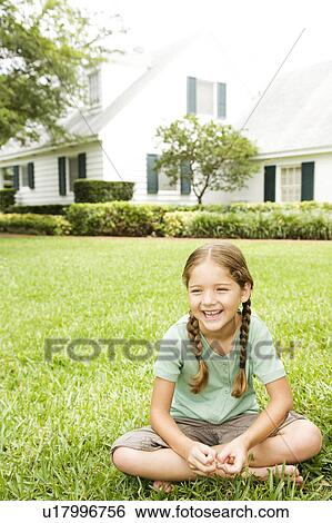 little girl with pigtails sitting cross legged on the lawn View Large Photo Image Stock Photograph - little girl with pigtails sitting cross legged on the lawn. Fotosearch