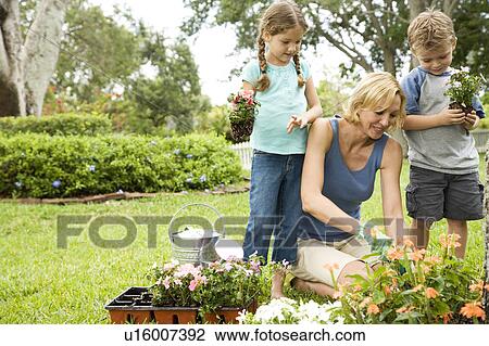 mother and children gardening View Large Photo Image Stock Image - mother and children gardening. Fotosearch