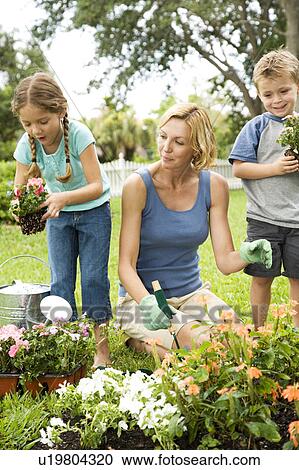 mother and children gardening View Large Photo Image Stock Image - mother and children gardening. Fotosearch
