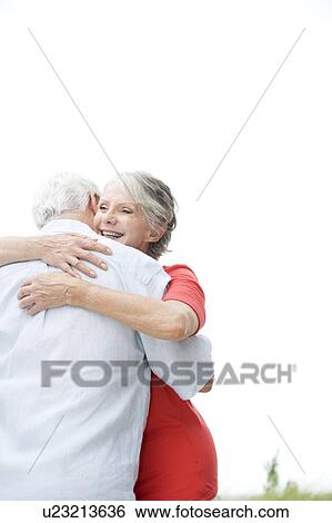 Stock Photograph - Senior couple embracing . Fotosearch
