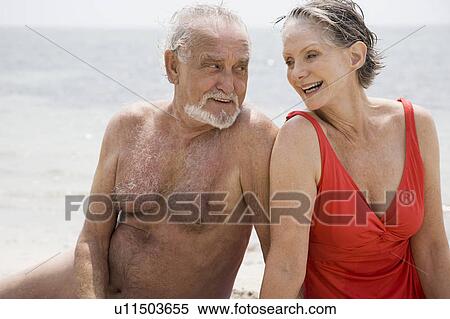 Senior couple relaxing at the beach View Large Photo Image Stock Photography - Senior couple relaxing at the beach . Fotosearch