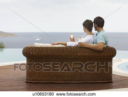 Stock Image - A couple drinking champagne. Fotosearch