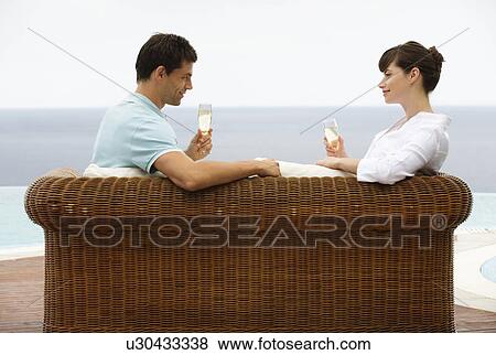 Stock Photo - A couple drinking champagne. Fotosearch