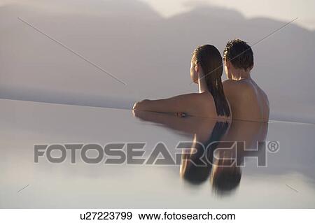 A couple relaxing in a pool View Large Photo Image Stock Photo - A couple relaxing in a pool. Fotosearch