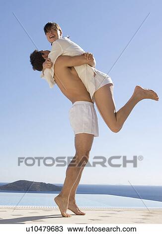 A couple embracing View Large Photo Image Stock Image - A couple embracing. Fotosearch