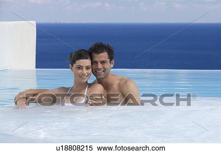 A couple relaxing in a jacuzzi View Large Photo Image Stock Photography - A couple relaxing in a jacuzzi. Fotosearch