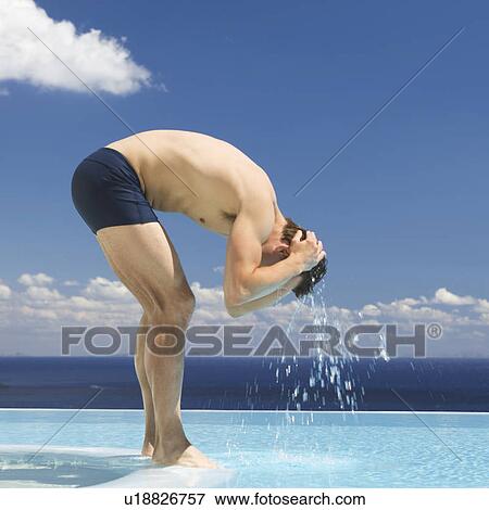 A man cooling off in a swimming pool View Large Photo Image Stock Photo - A man cooling off in a swimming pool. Fotosearch