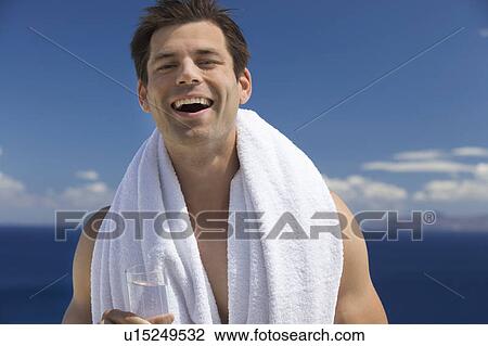 A man relaxing in the sun View Large Photo Image Stock Image - A man relaxing in the sun. Fotosearch