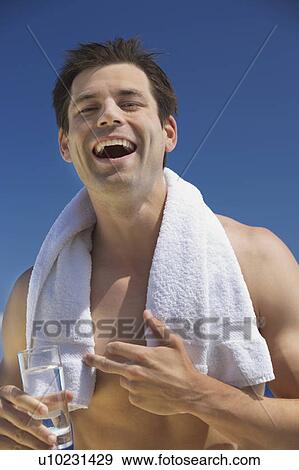 Stock Photo - A man relaxing in the sun. Fotosearch