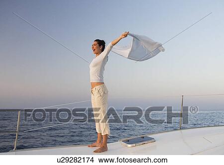 A woman relaxing on a boat View Large Photo Image Picture - A woman relaxing on a boat. Fotosearch