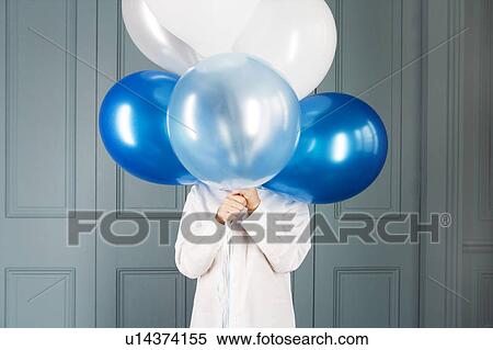 boy hiding behind a bunch of balloons View Large Photo Image Stock Photography - boy hiding behind a bunch of balloons. Fotosearch