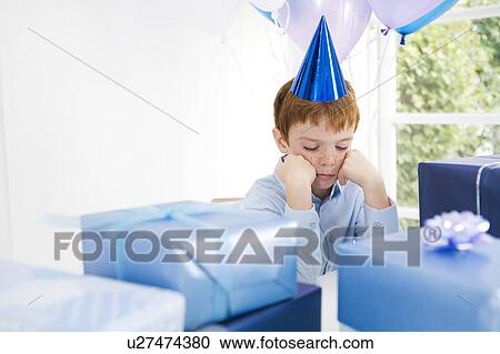 boy looking sad at birthday party View Large Photo Image Stock Image - boy looking sad at birthday party. Fotosearch