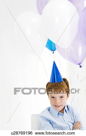 boy with balloons and party hat View Large Photo Image Stock Photograph - boy with balloons and party hat. Fotosearch