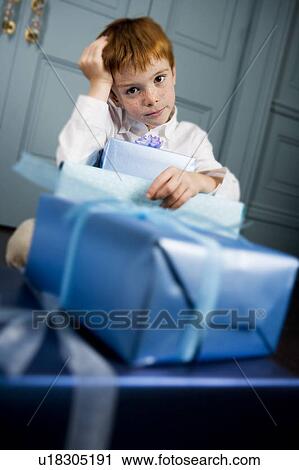 ginger haired boy with lots of presents View Large Photo Image Stock Image - ginger haired boy with lots of presents. Fotosearch
