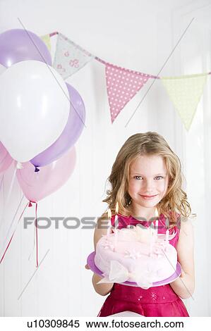 happy little girl holding birthday cake View Large Photo Image Stock Photography - happy little girl holding birthday cake. Fotosearch