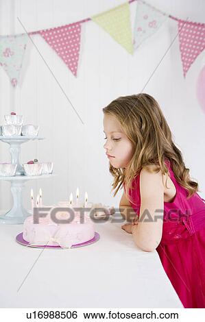 little girl looking at birthday cake View Large Photo Image Stock Photograph - little girl looking at birthday cake. Fotosearch