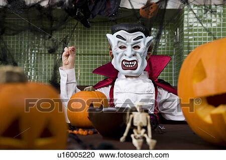 Little boy in a Dracula outfit dressed up for Halloween View Large Photo Image Stock Image - Little boy in a Dracula outfit dressed up for Halloween . Fotosearch