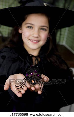 Little girl in a witch's costume for Halloween View Large Photo Image Stock Photograph - Little girl in a witch's costume for Halloween . Fotosearch