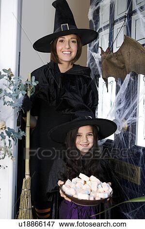 Mother and daughter dressed up as witches for Halloween View Large Photo Image Stock Photo - Mother and daughter dressed up as witches for Halloween. Fotosearch