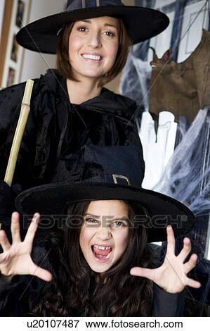 Mother and daughter dressed up as witches for Halloween View Large Photo Image Stock Photo - Mother and daughter dressed up as witches for Halloween. Fotosearch