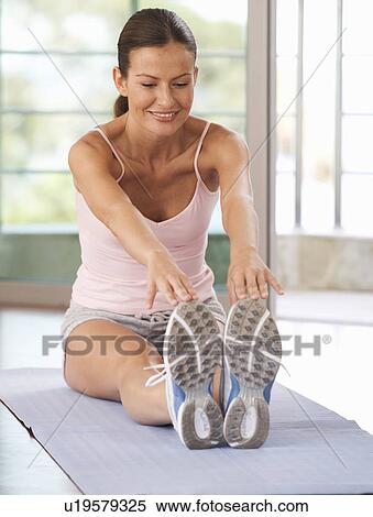 A woman exercising View Large Photo Image Stock Photography - A woman exercising. Fotosearch