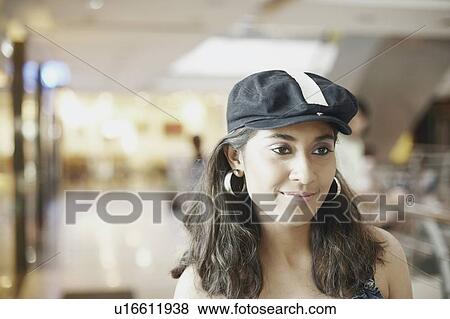 Stock Photo - Portrait of a young woman smiling. Fotosearch