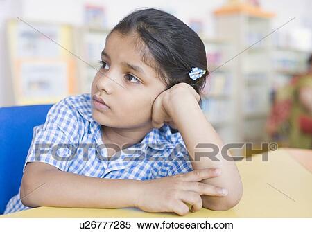 Stock Photography - Close-up of a girl thinking. Fotosearch