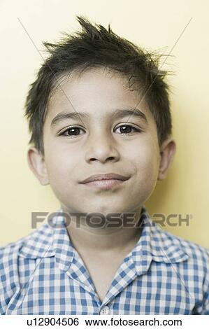 Stock Photograph - Portrait of a schoolboy smirking. Fotosearch