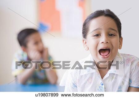 Portrait of a schoolgirl shouting View Large Photo Image Stock Photo - Portrait of a schoolgirl shouting. Fotosearch