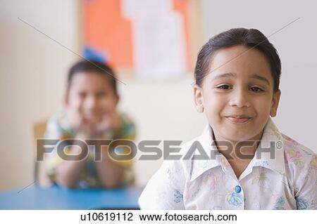 Portrait of a schoolgirl smiling View Large Photo Image Stock Image - Portrait of a schoolgirl smiling. Fotosearch
