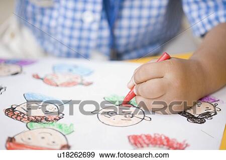 Close-up of child's hand drawing on a sheet of paper View Large Photo Image Stock Photo - Close-up of child's hand drawing on a sheet of paper. Fotosearch