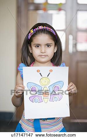 Portrait of a girl showing her drawing View Large Photo Image Stock Photo - Portrait of a girl showing her drawing. Fotosearch