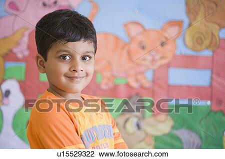 Portrait of a schoolboy smiling View Large Photo Image Stock Image - Portrait of a schoolboy smiling. Fotosearch